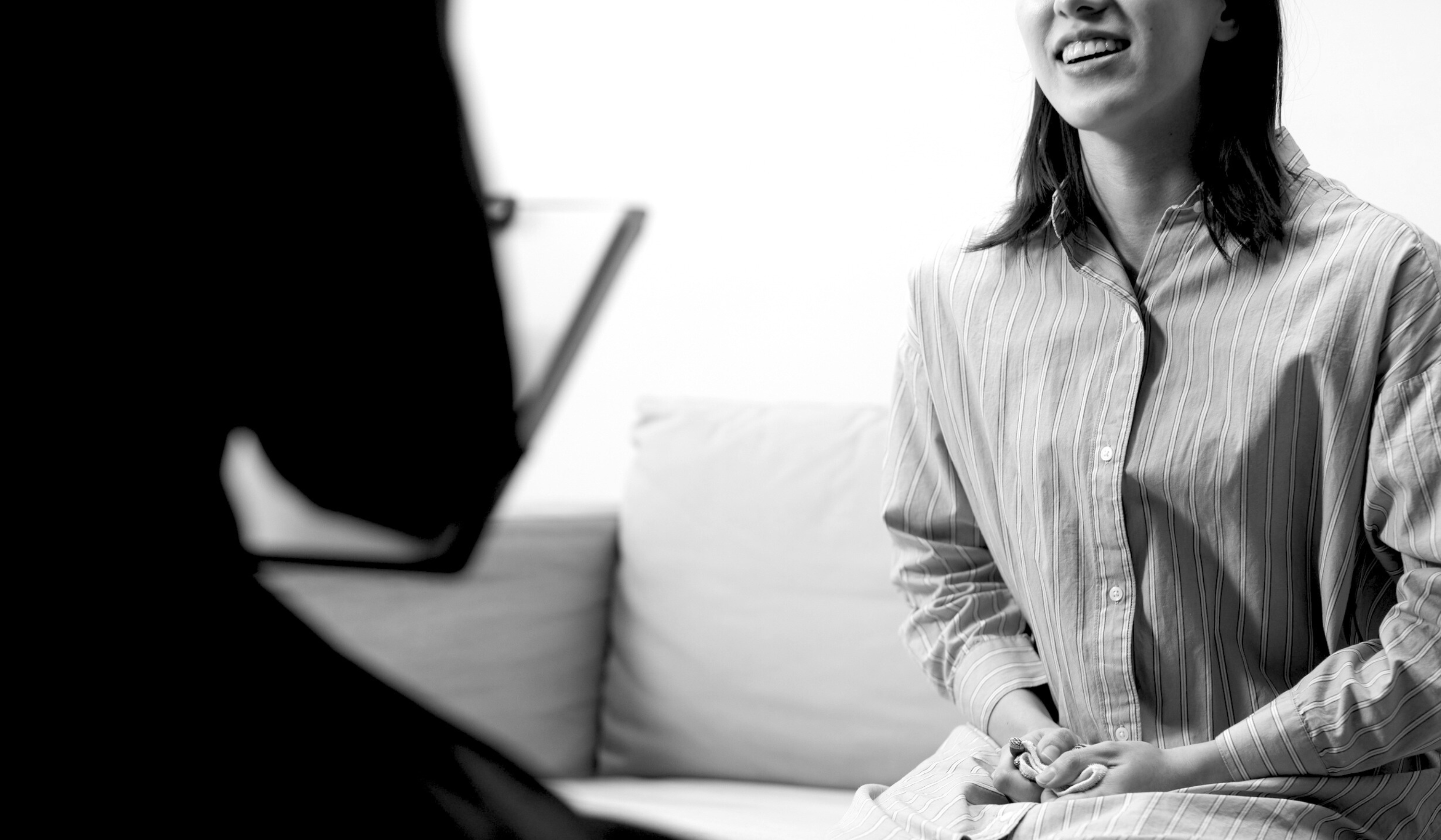 Business leader interviewing a marketer in an office, symbolising the importance of hiring early to prepare for next year’s campaigns.