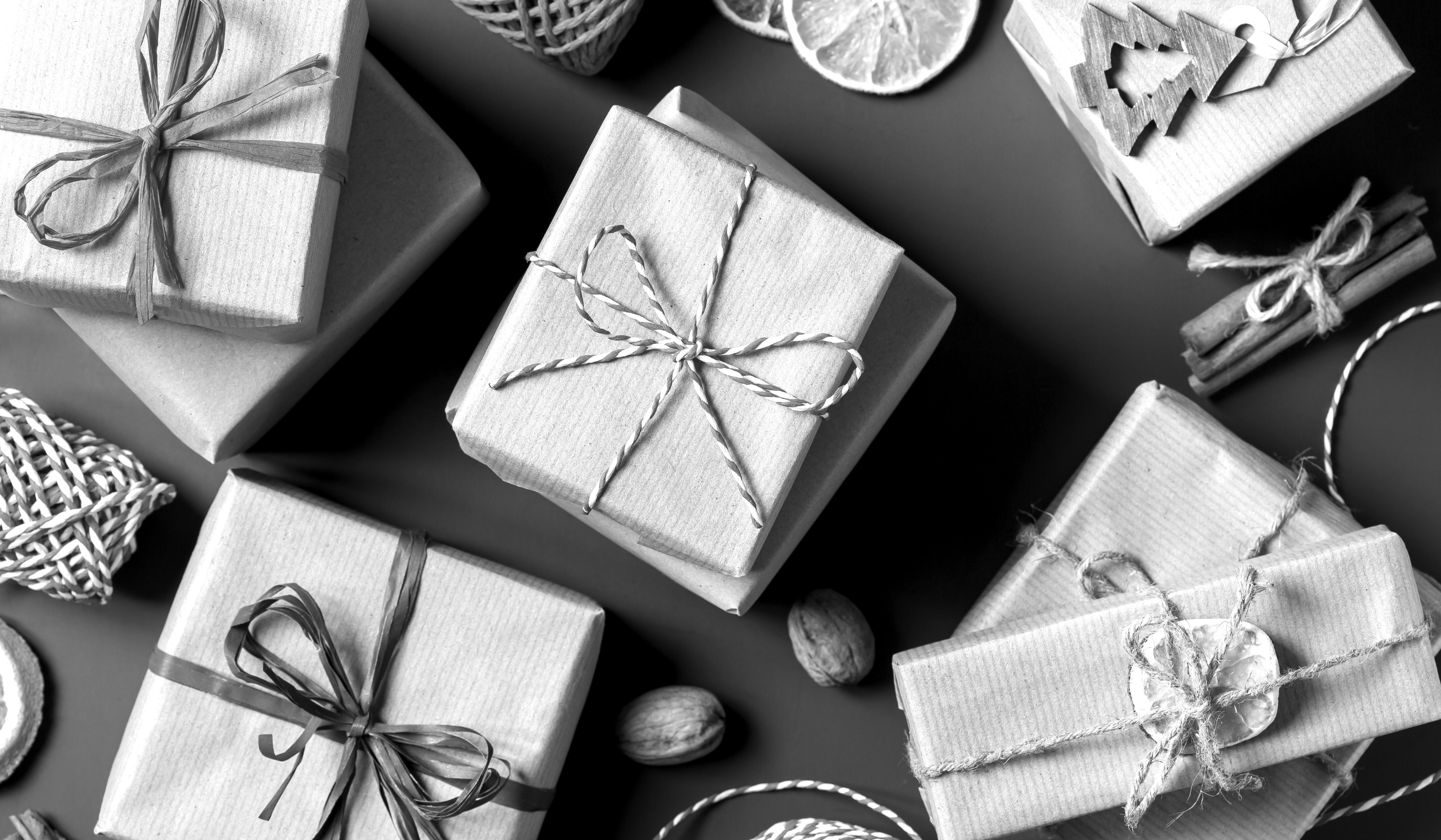 Illustration of festive gift boxes tied with brand logos, symbolising how businesses can align marketing campaigns with holiday gifting seasons.