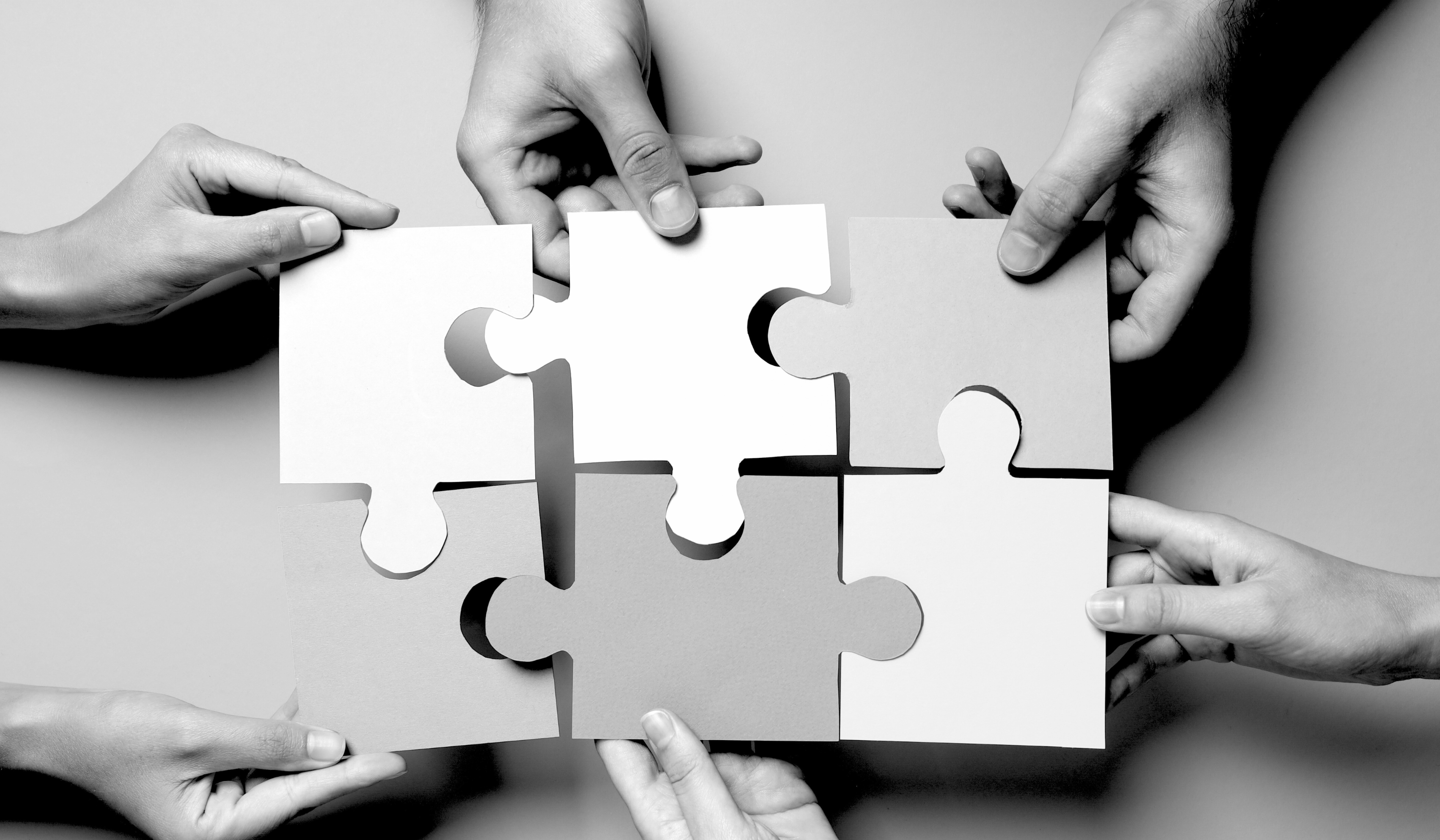 Illustration of two businesses shaking hands at a trade show booth, symbolising partnerships that turn events into profitable channels.